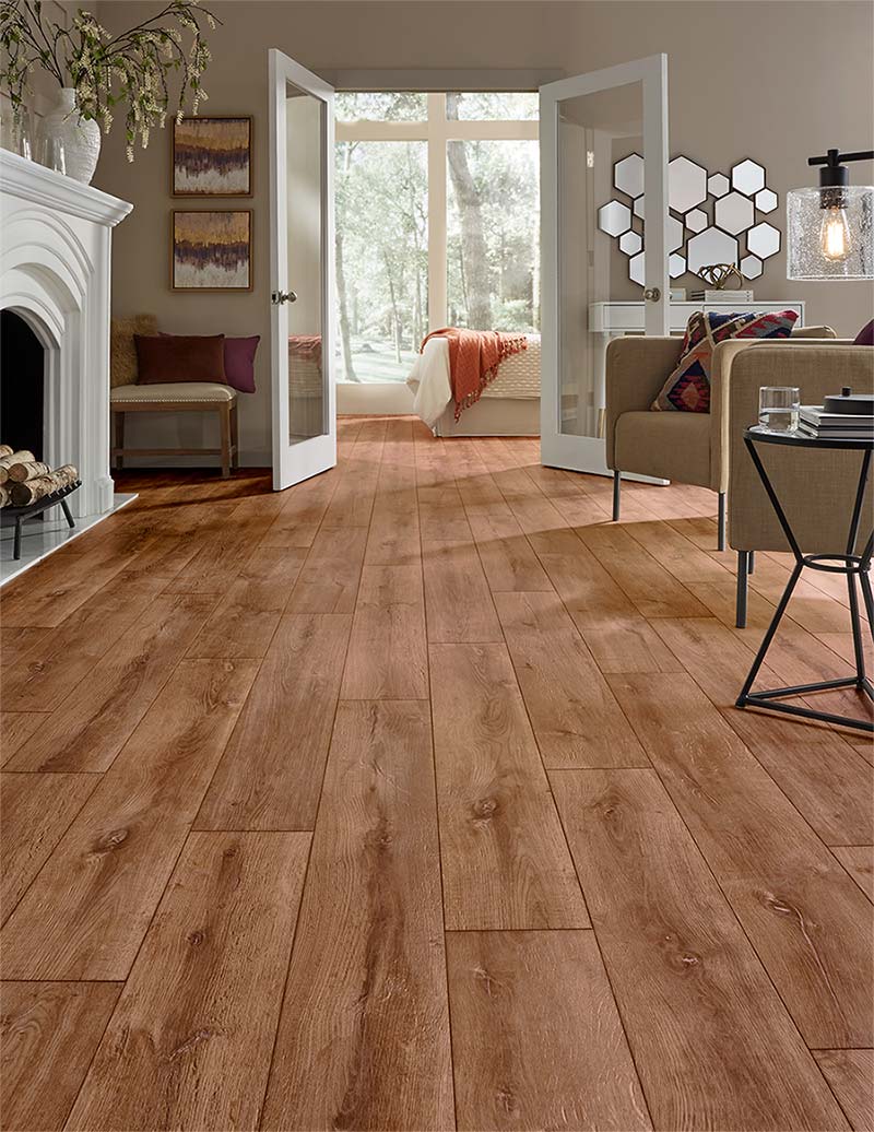 Reddish wood-look luxury vinyl plank modern room scene